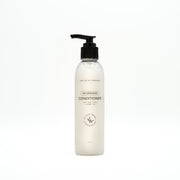 Bottle of nourishing conditioner on a white background