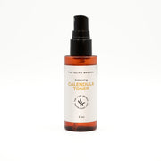 Calendula toner bottle with spray nozzle on a white background