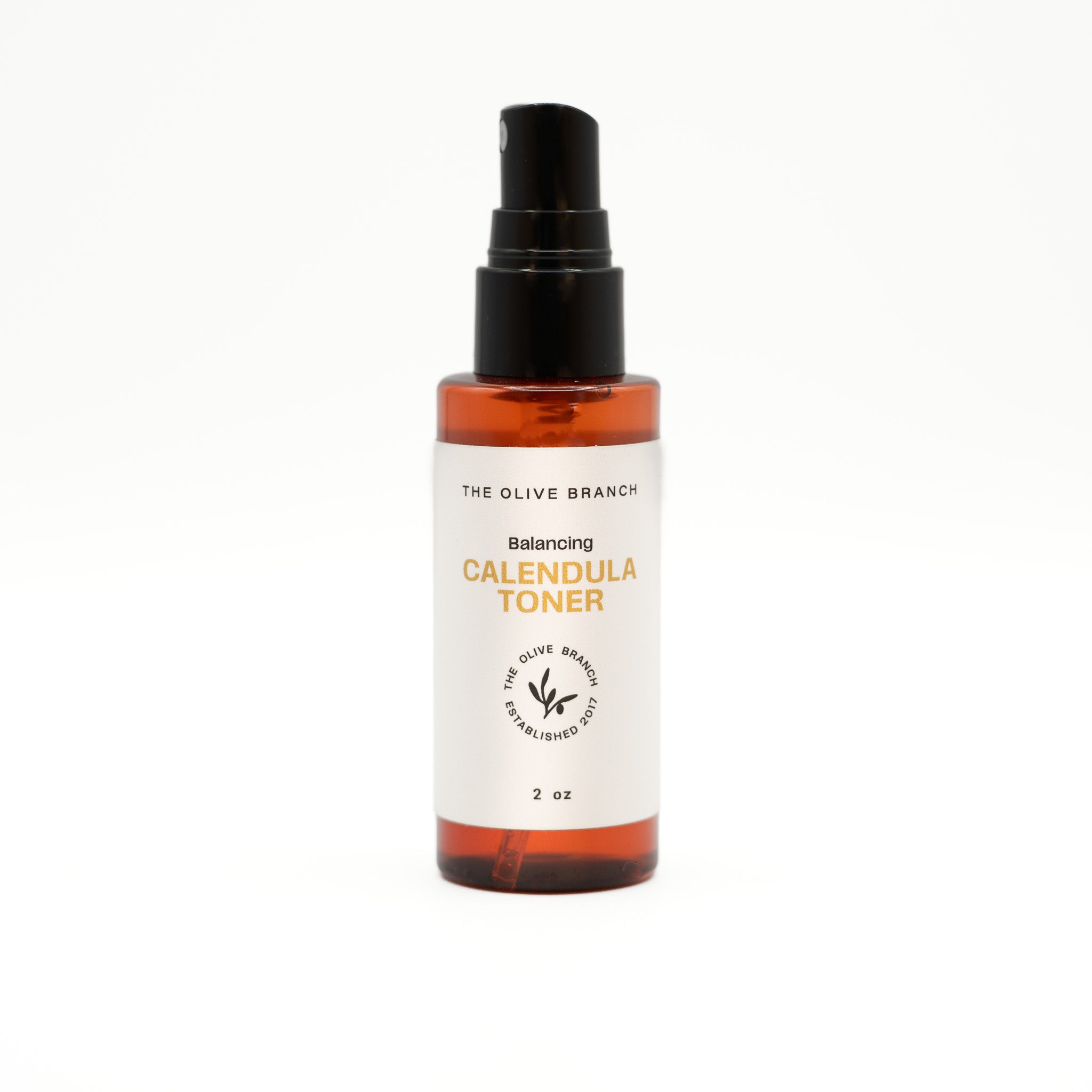 Calendula toner bottle with spray nozzle on a white background