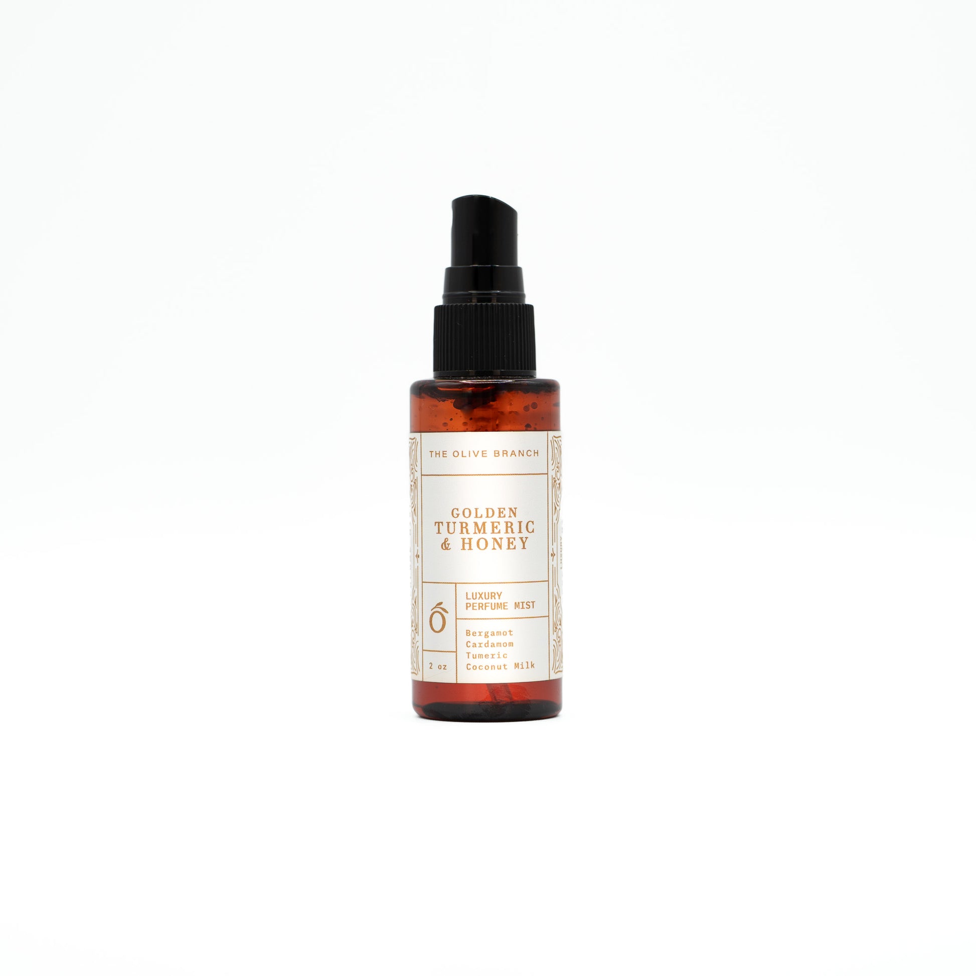Bottle of Golden Turmeric & Honey perfume mist on a white background