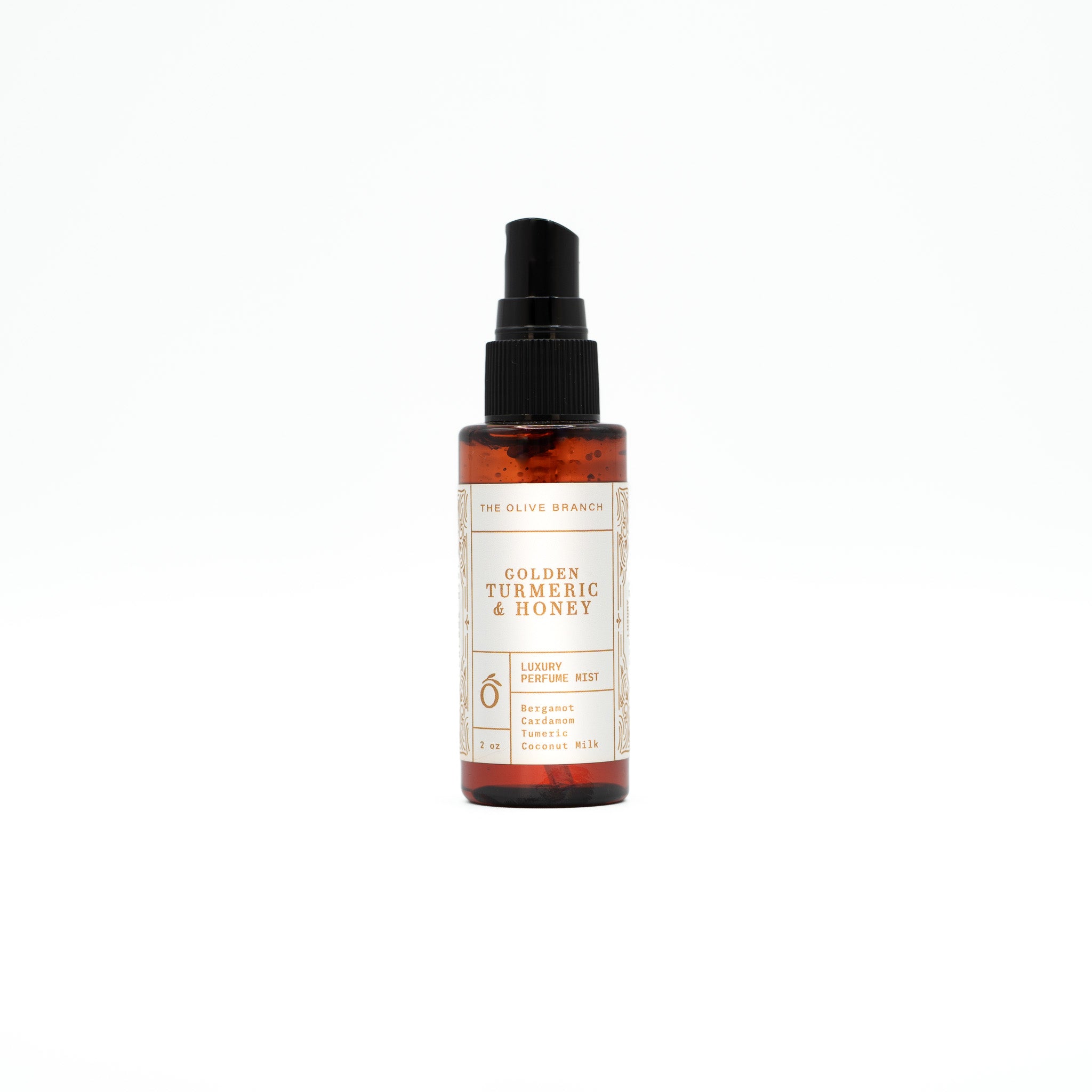 Bottle of Golden Turmeric & Honey perfume mist on a white background