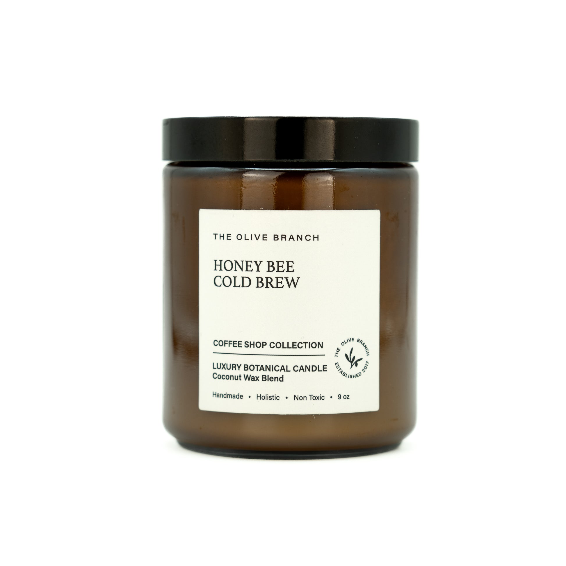 Candle jar labeled 'Honey Bee Cold Brew' from The Olive Branch on a white background