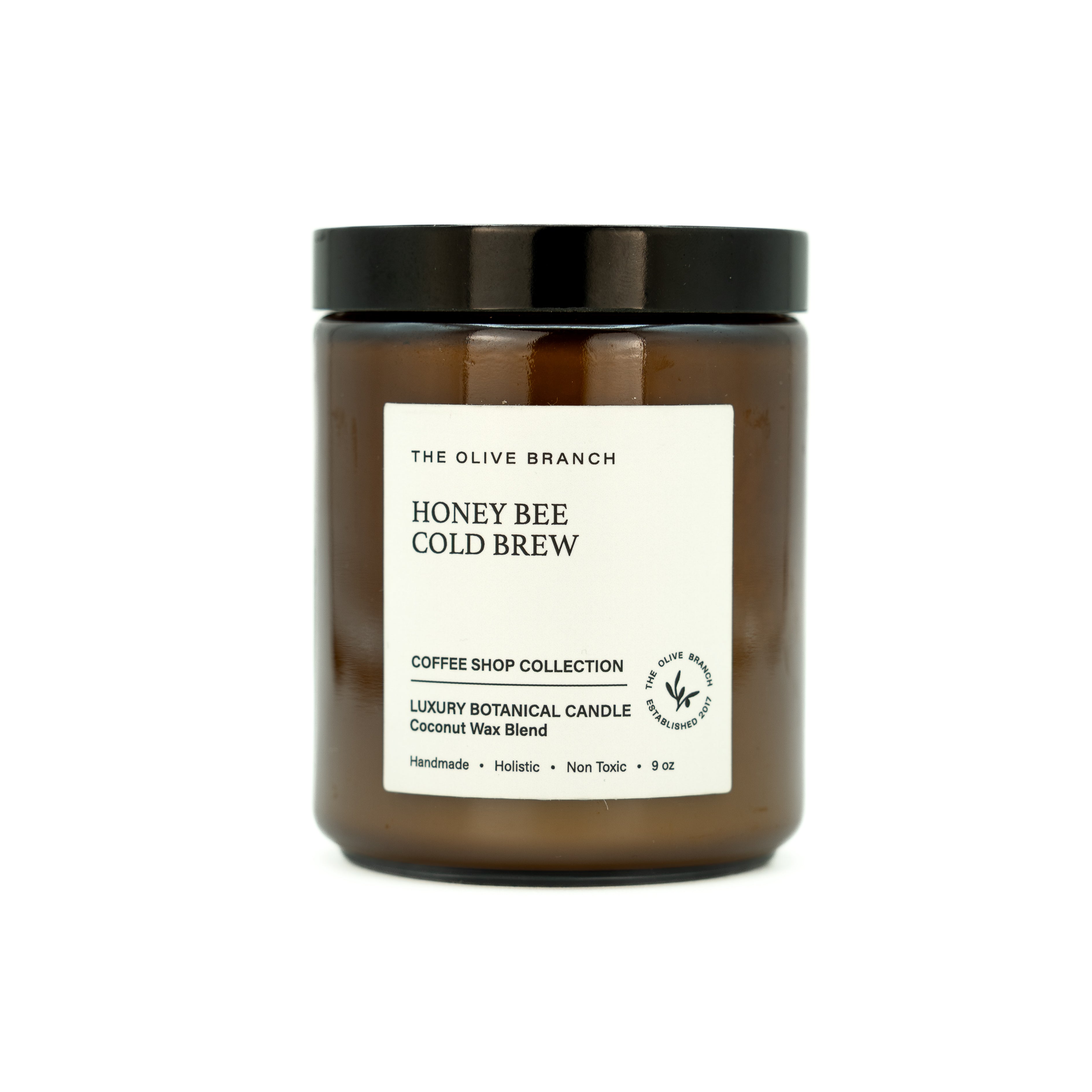 Candle jar labeled 'Honey Bee Cold Brew' from The Olive Branch on a white background