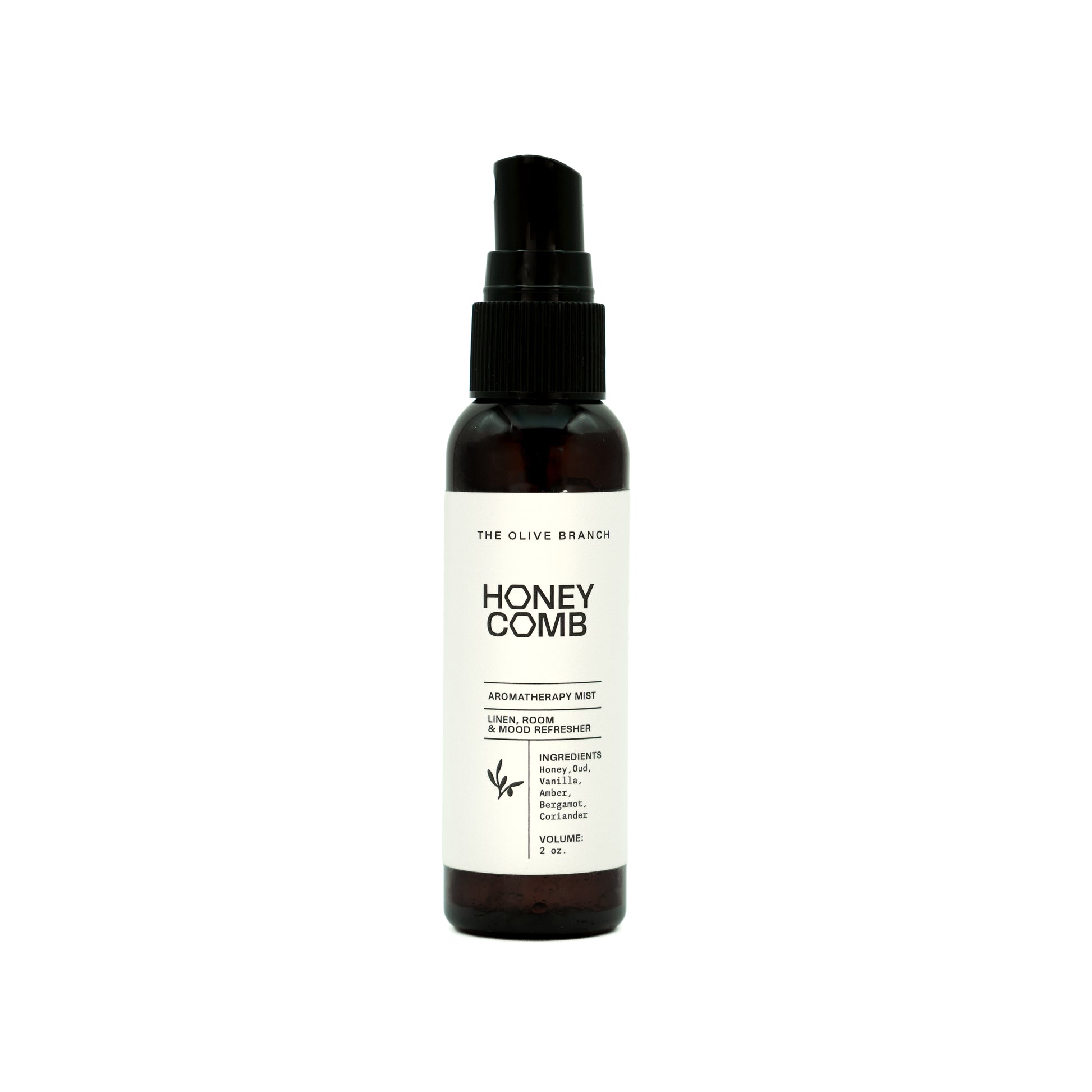 Honey Comb aromatherapy mist bottle with black cap on a white background