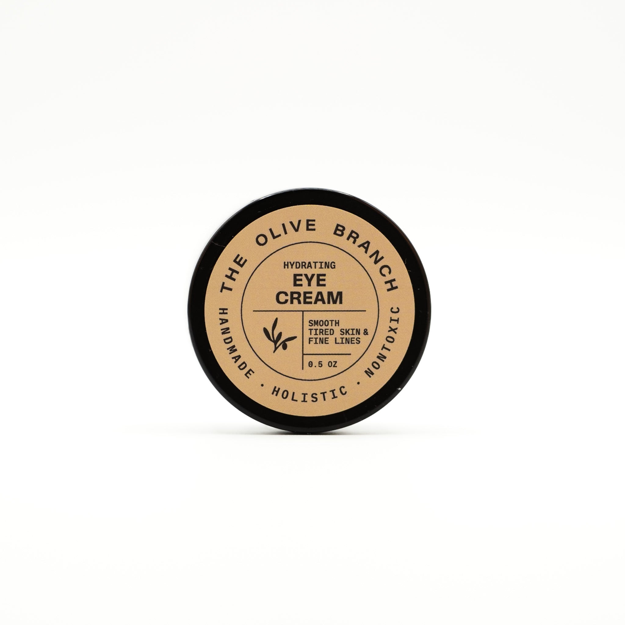 Eye cream container labeled 'The Olive Branch' on a white background
