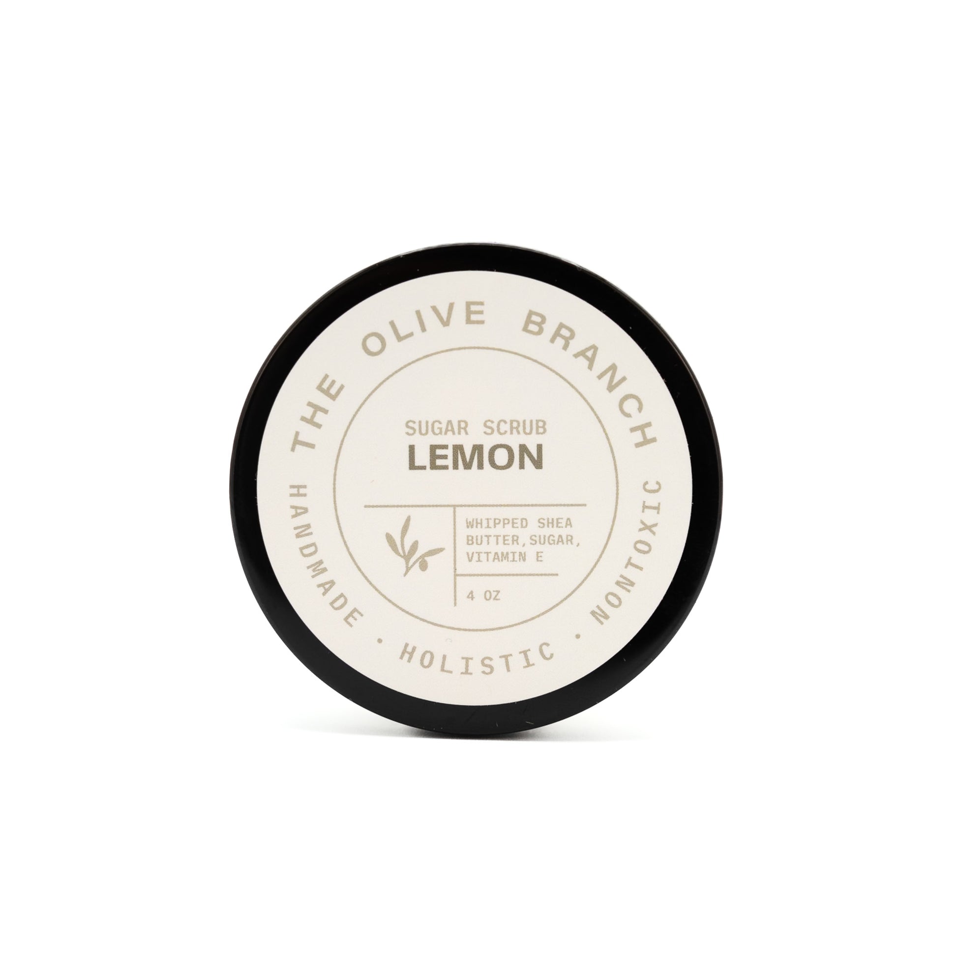 Jar of lemon sugar scrub from The Olive Branch on a white background