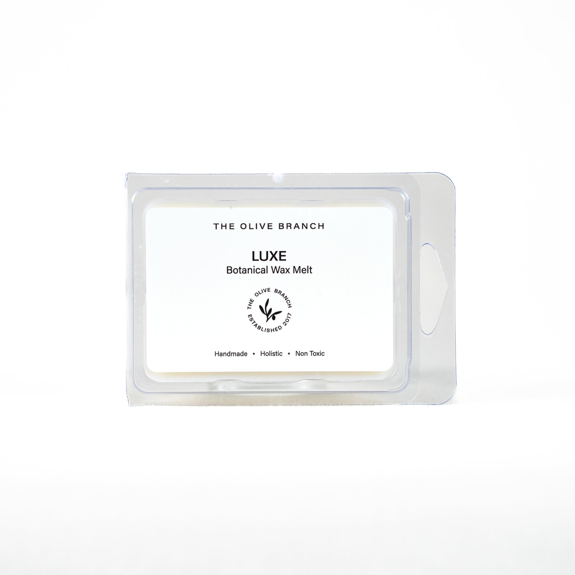 LUXE botanical wax melt packaging with 'The Olive Branch' branding on a white background
