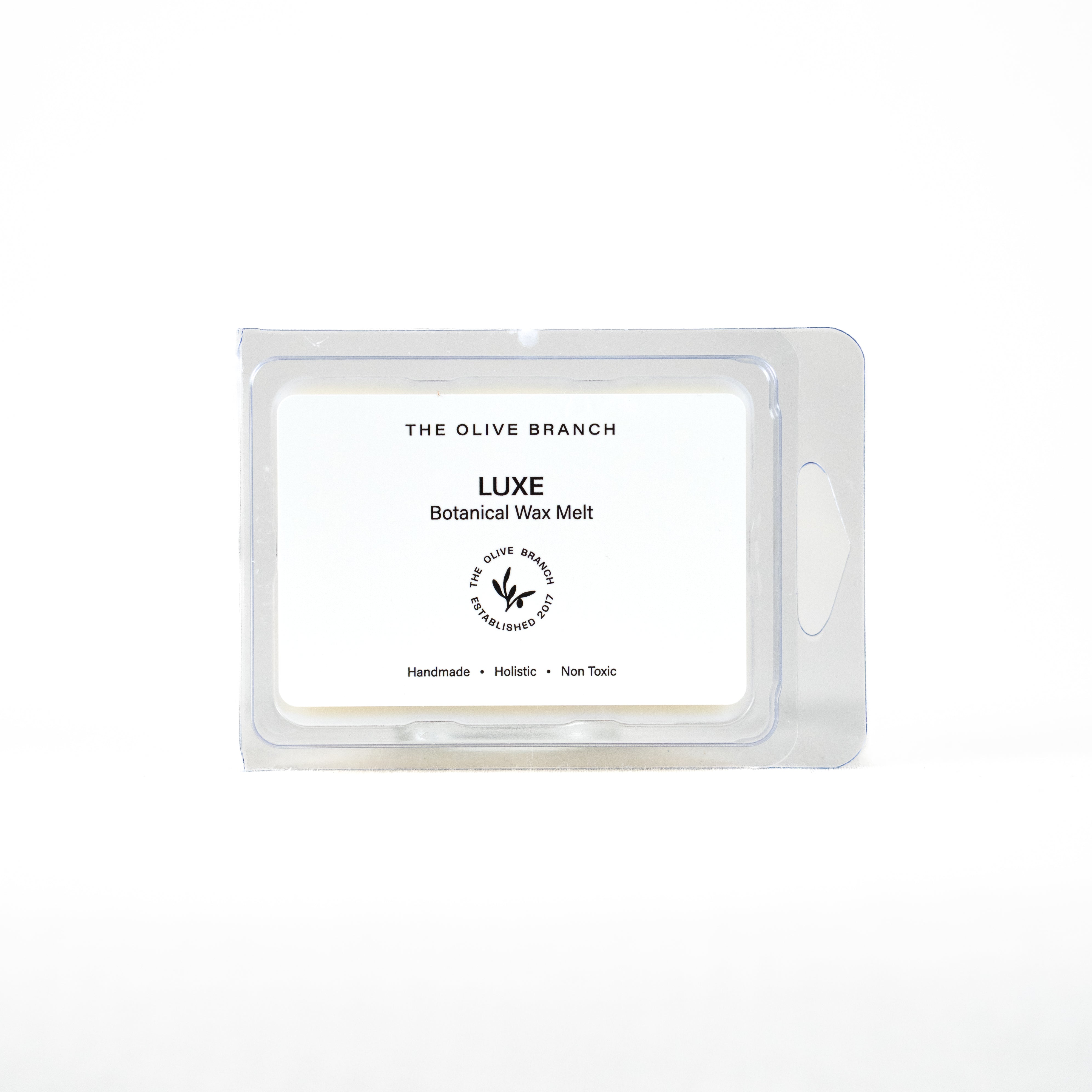 LUXE botanical wax melt packaging with 'The Olive Branch' branding on a white background