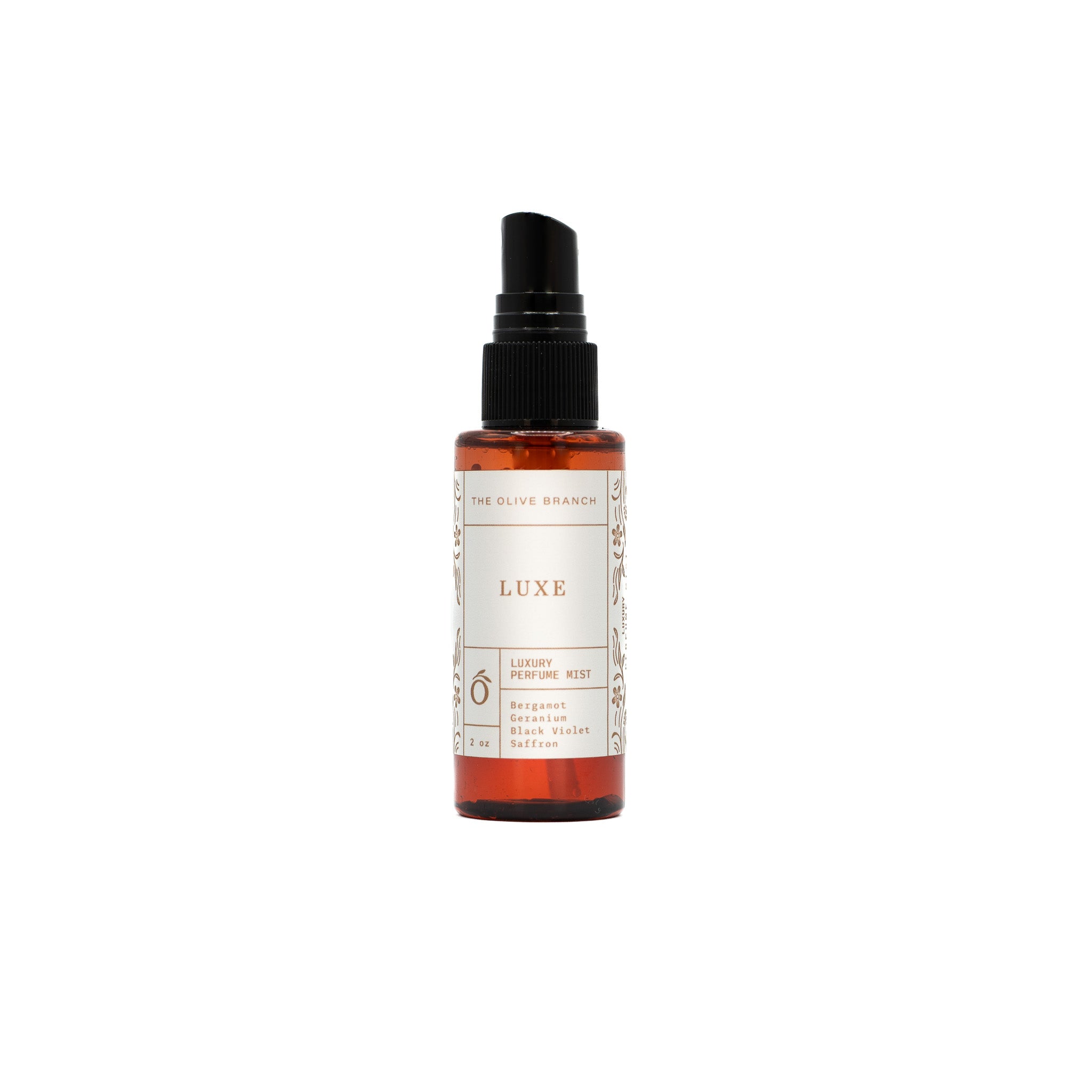 luxe perfume mist bottle on a white background