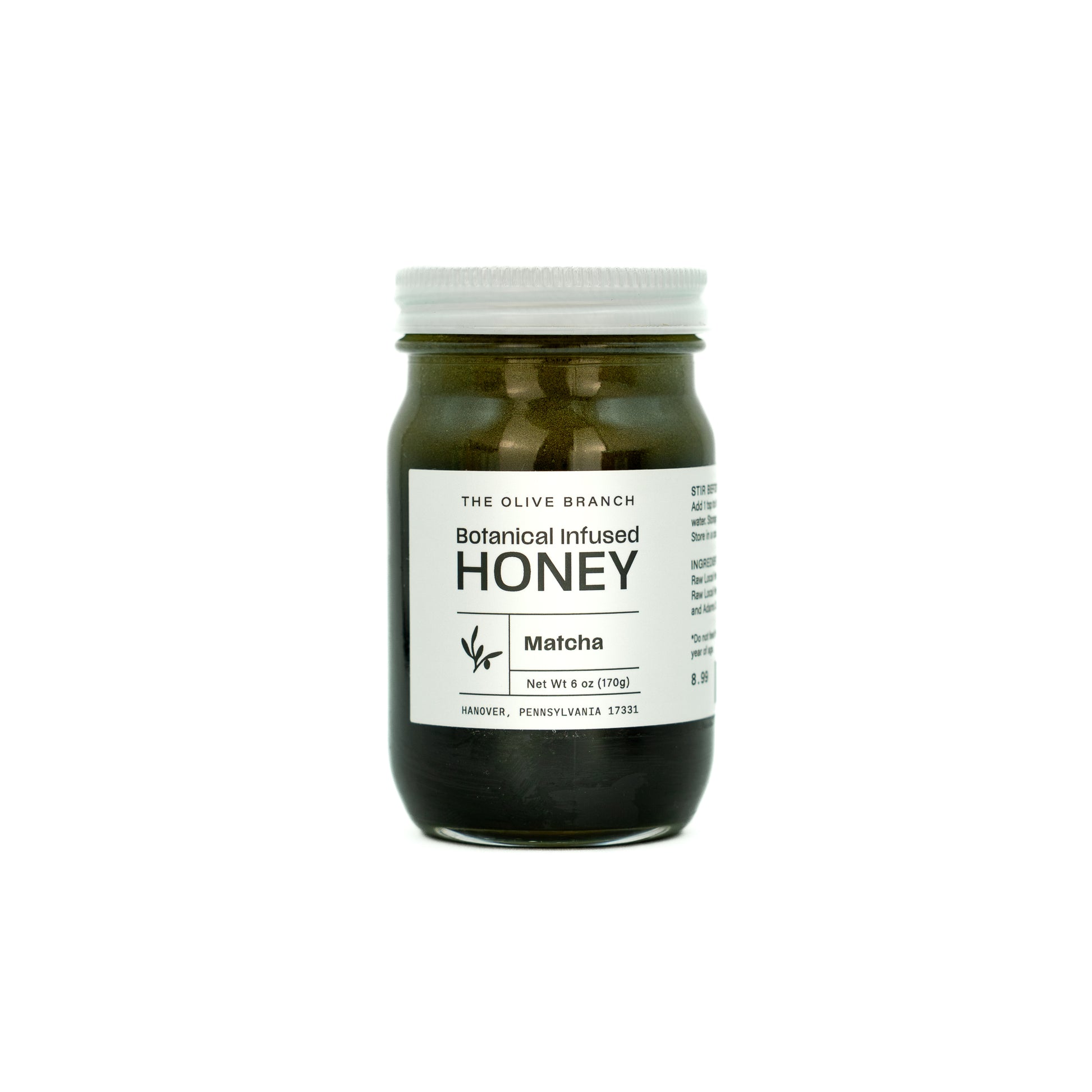 Jar of Botanical Infused Honey with Matcha flavor on a white background