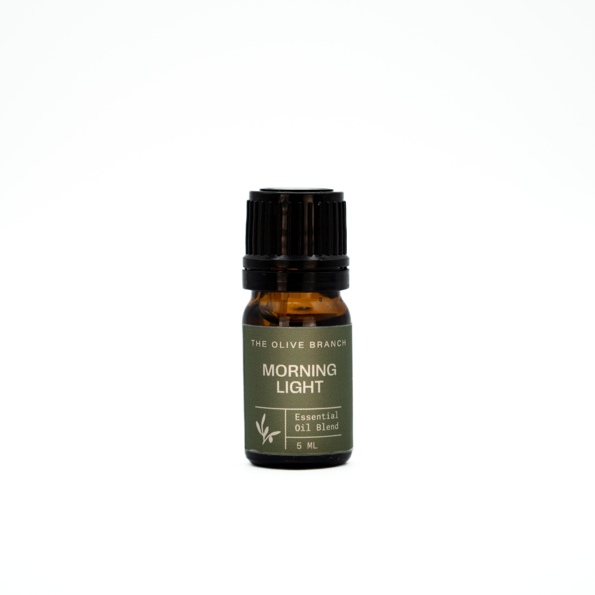 Essential oil bottle labeled 'Morning Light' by 'The Olive Branch' on a white background
