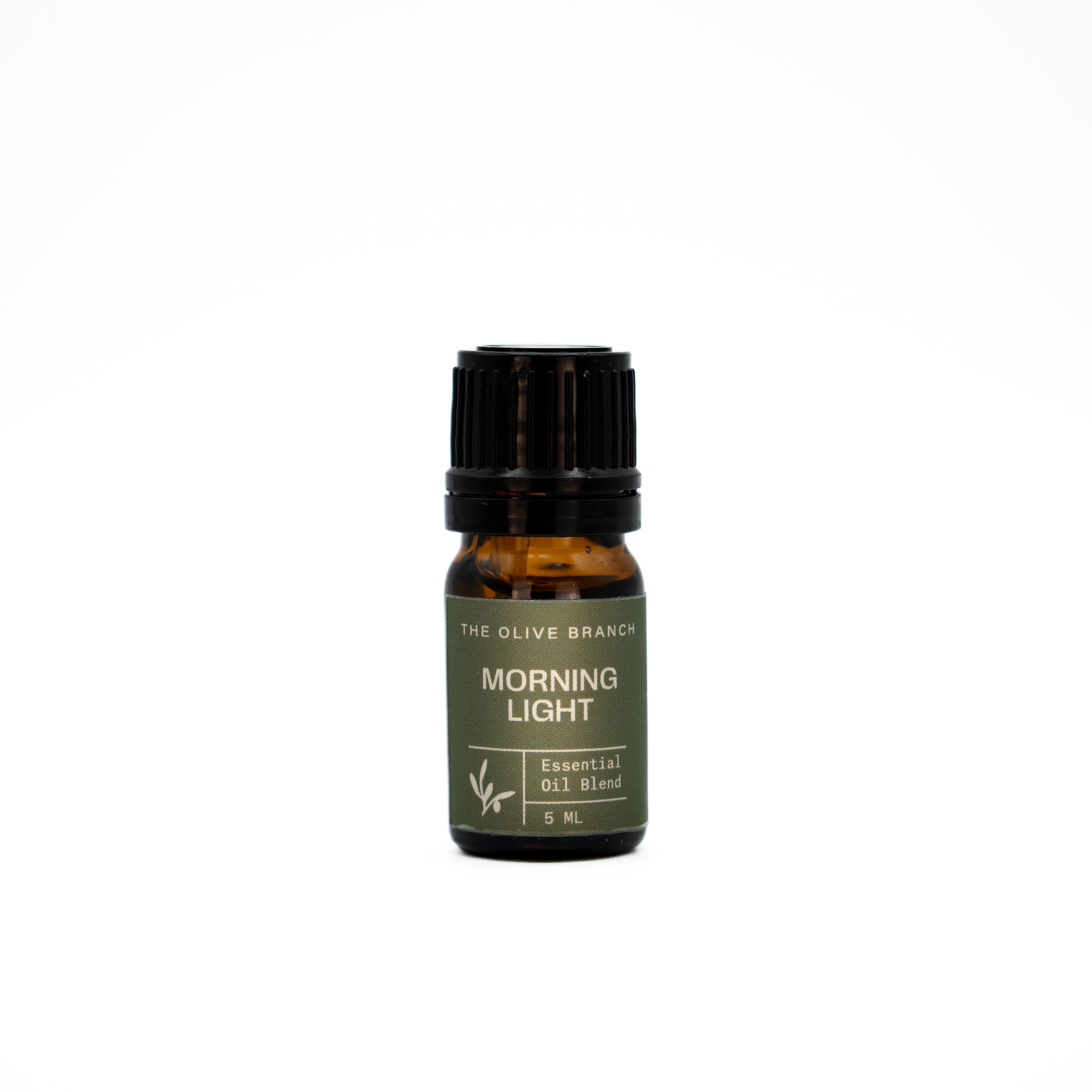Essential oil bottle labeled 'Morning Light' by 'The Olive Branch' on a white background