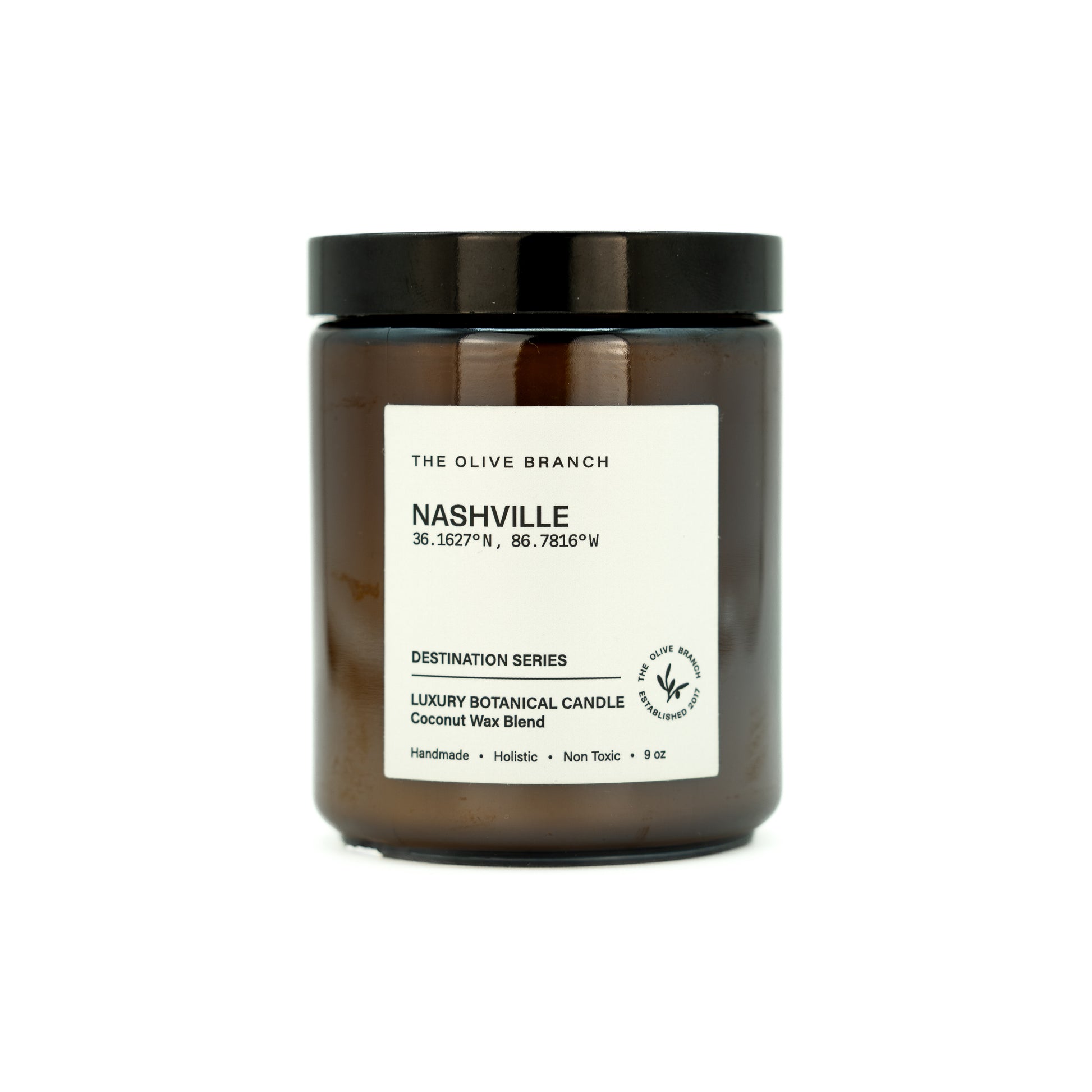 Brown candle jar labeled 'Nashville' on a white background