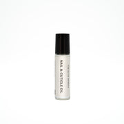 Nail and cuticle oil bottle with black cap on a white background
