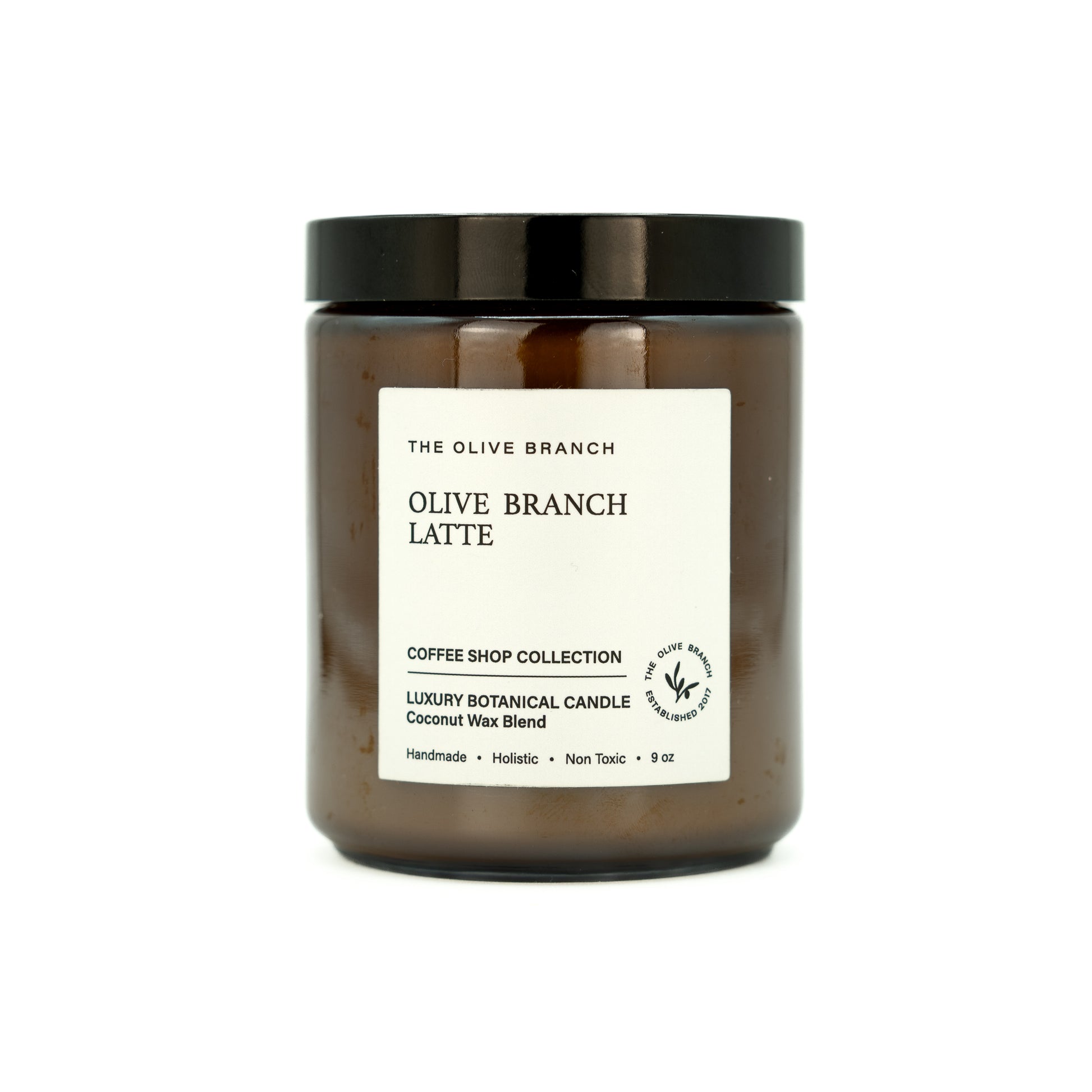 Candle jar labeled 'Olive Branch Latte' from 'The Olive Branch' on a white background