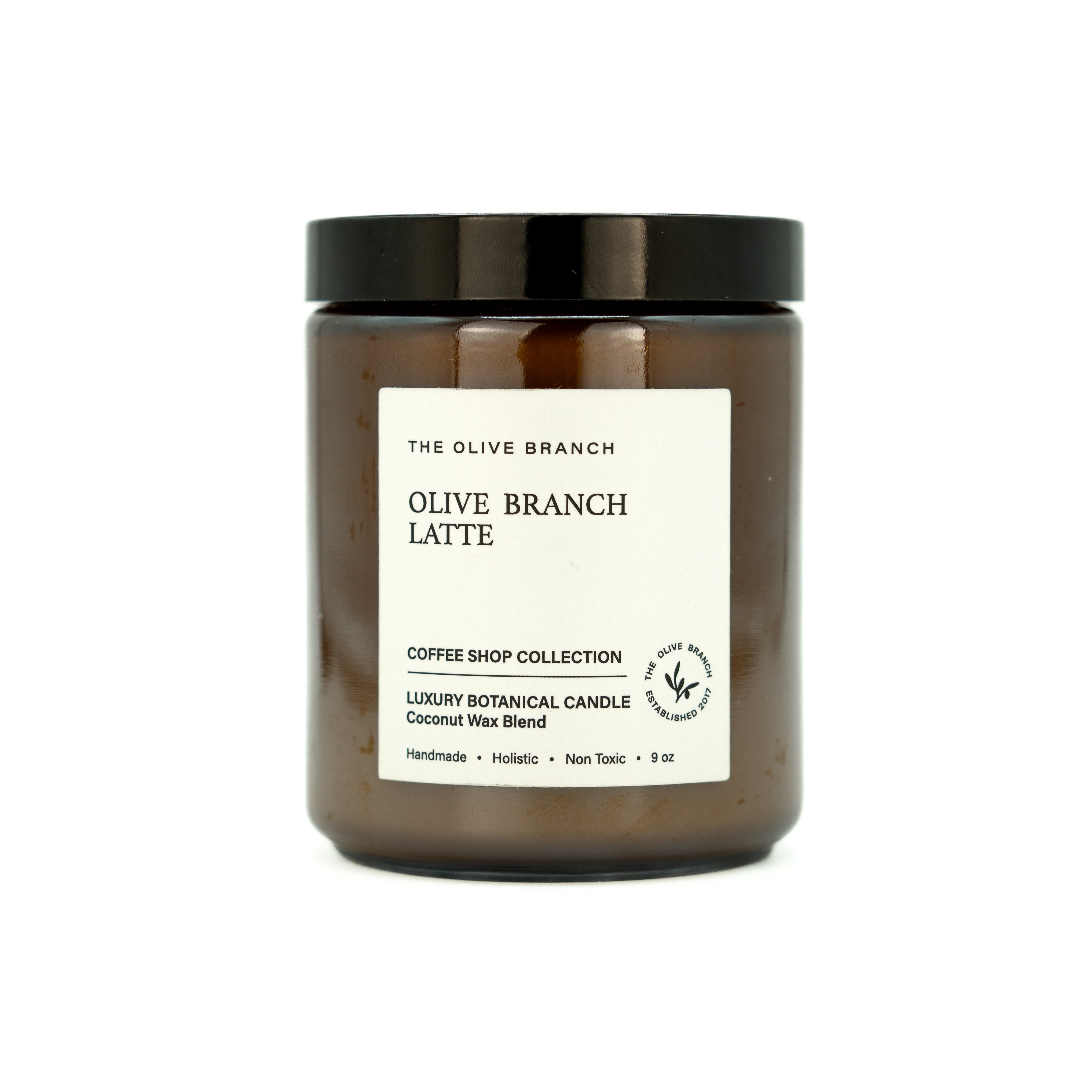 Candle jar labeled 'Olive Branch Latte' from 'The Olive Branch' on a white background