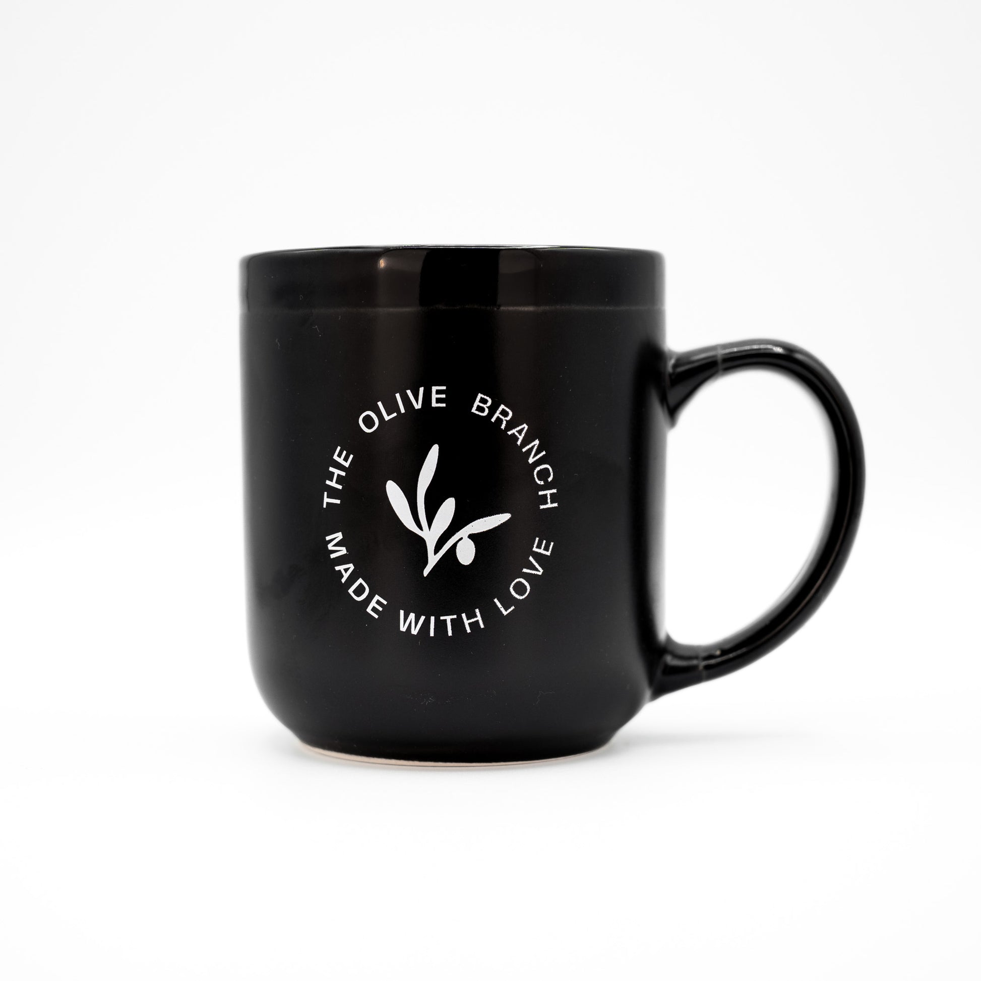 Black mug with 'The Olive Branch Made with Love' logo on a white background
