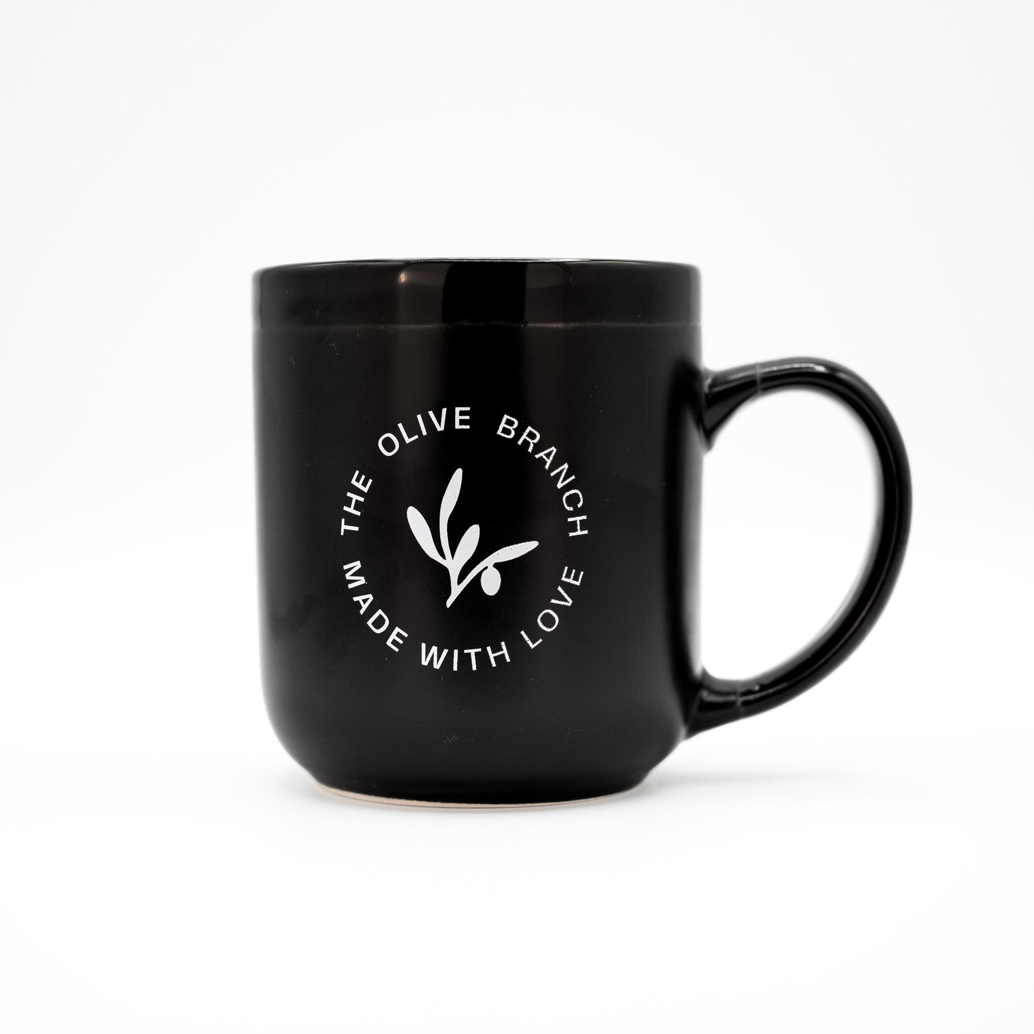 Black mug with 'The Olive Branch Made with Love' logo on a white background
