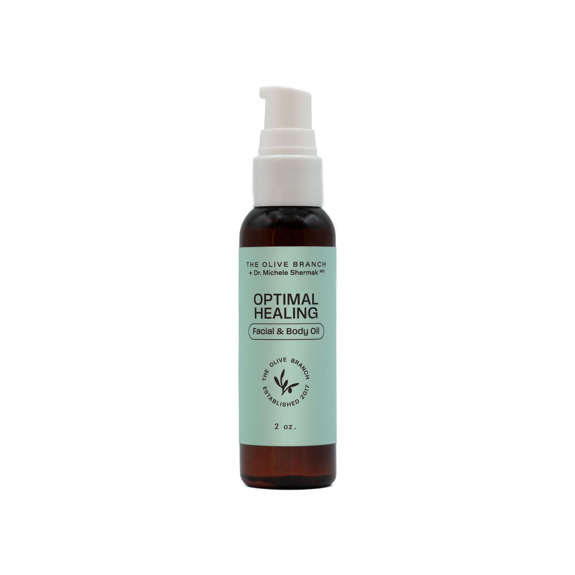 Bottle of 'Optimal Healing' facial and body oil on a white background