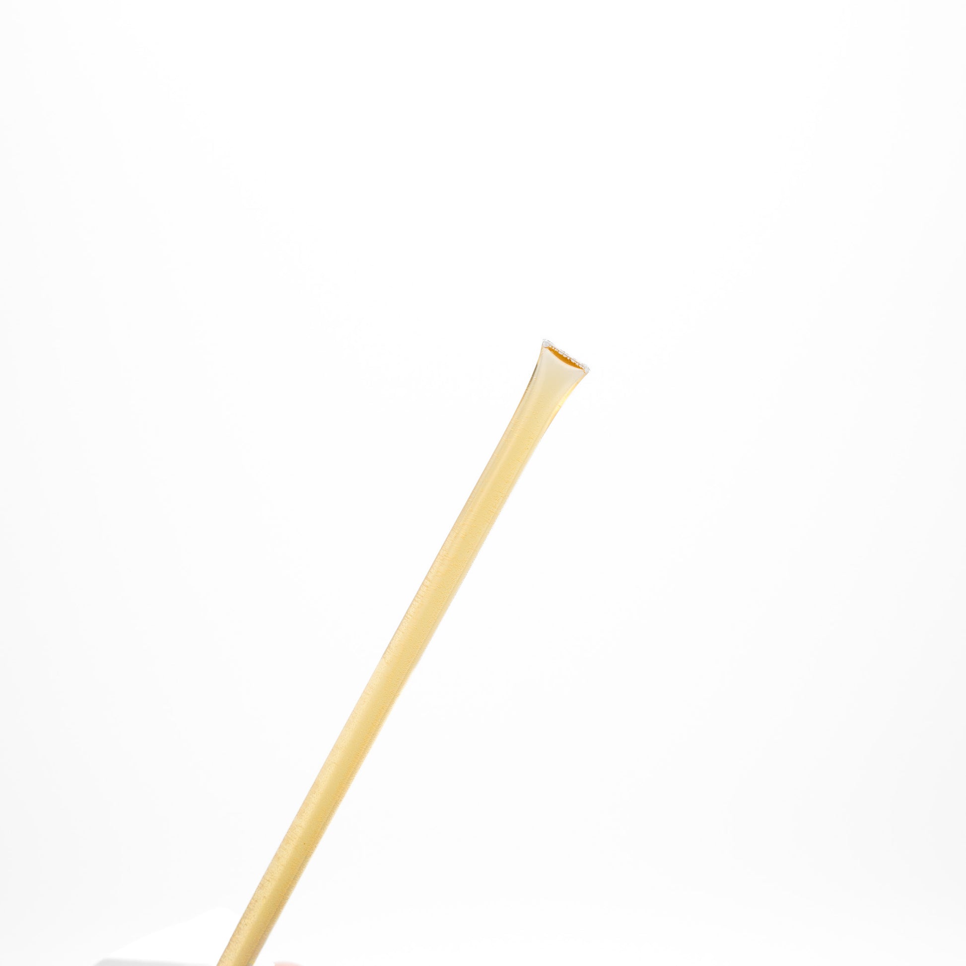 Raw honey sticks on a white background