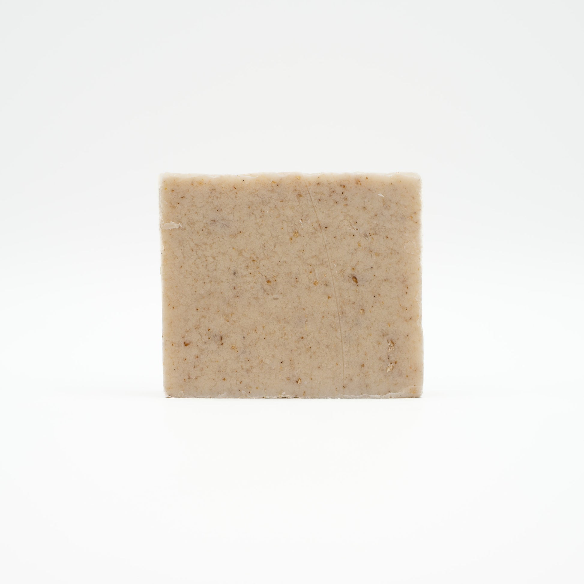 Square bar of Penny's Puppy Bar soap on a white background
