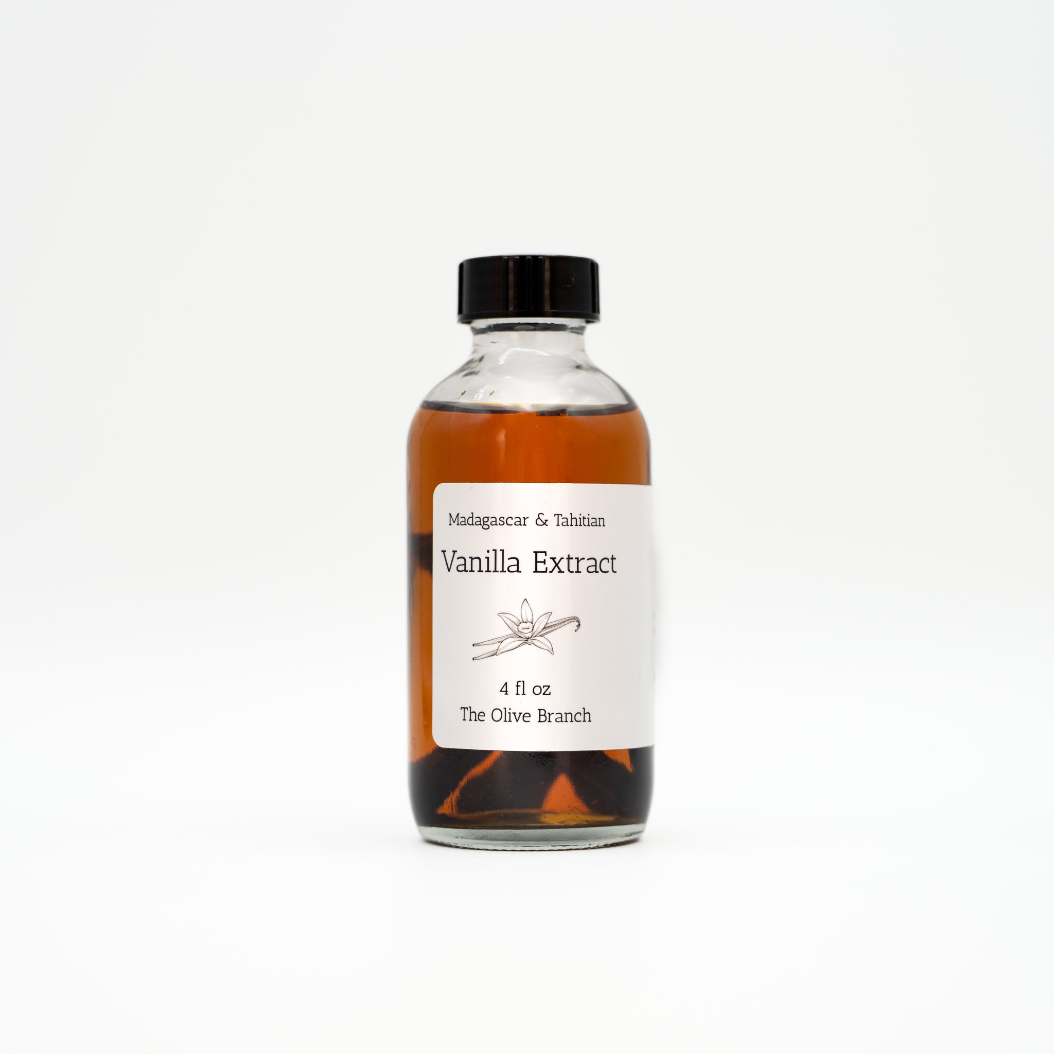 Bottle of vanilla extract with a label on a white background