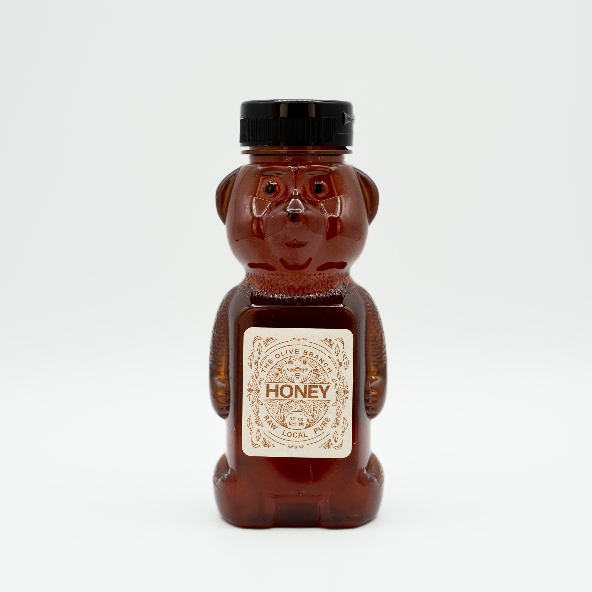 Honey bear bottle with a label on a white background