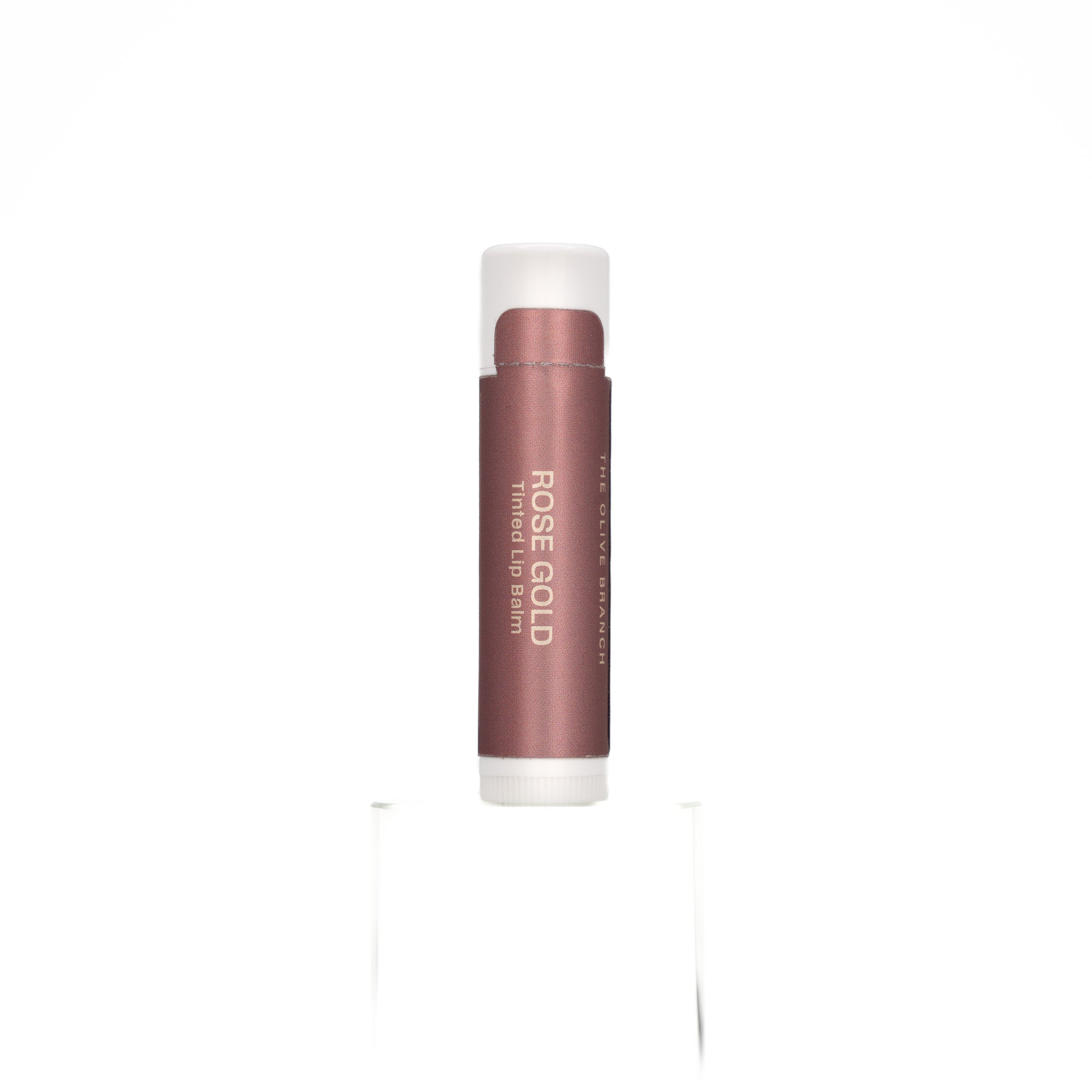 Lip balm with 'Rose Gold' color on a white background
