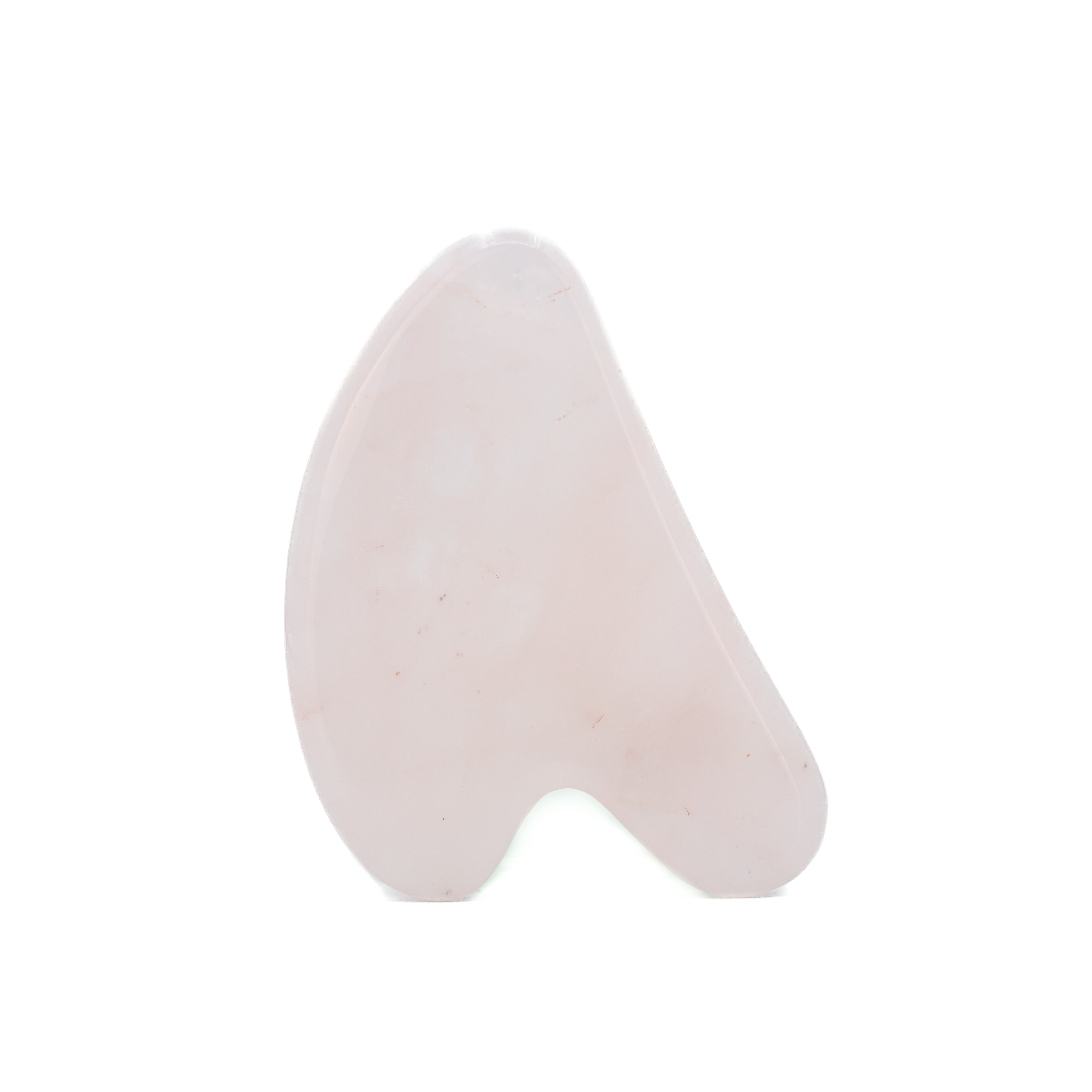 Rose quartz gua sha on a white background.