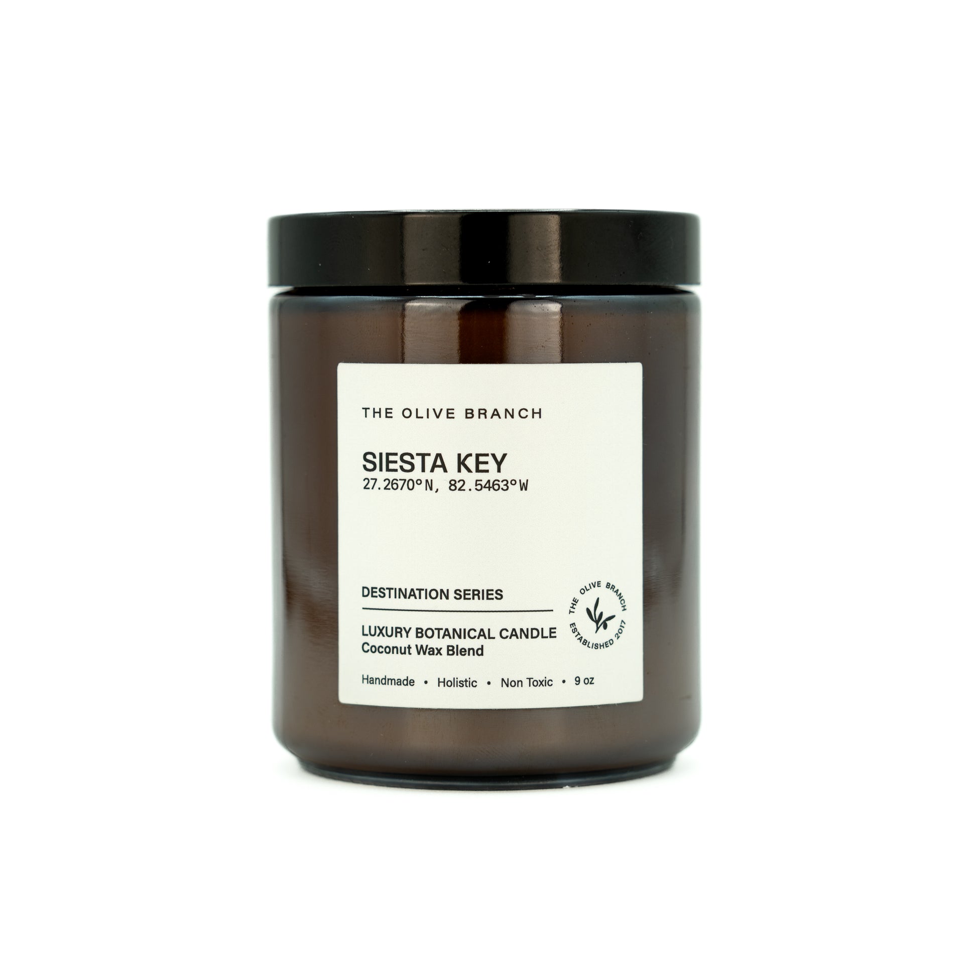 Candle jar labeled 'siesta key' on a white background