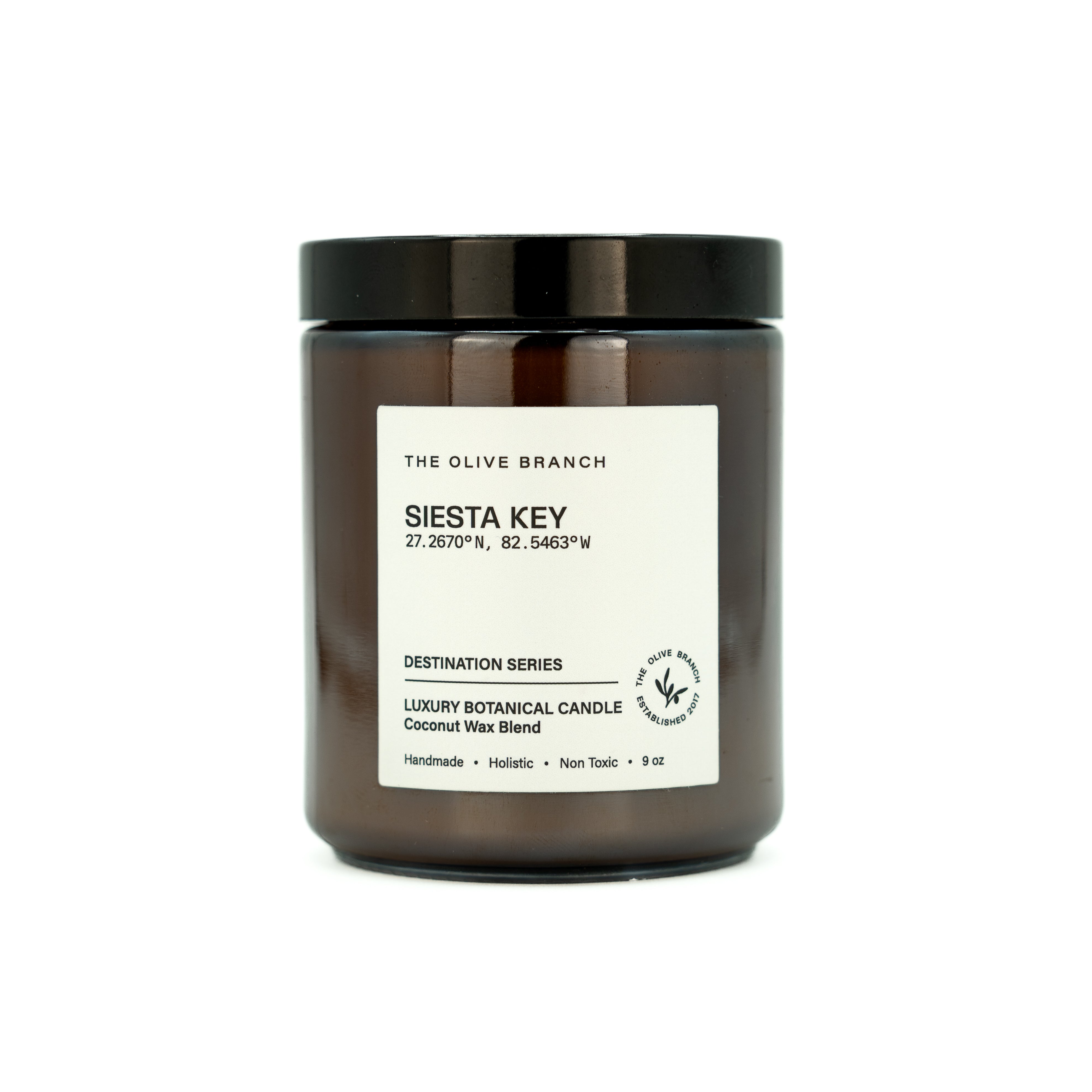 Candle jar labeled 'siesta key' on a white background