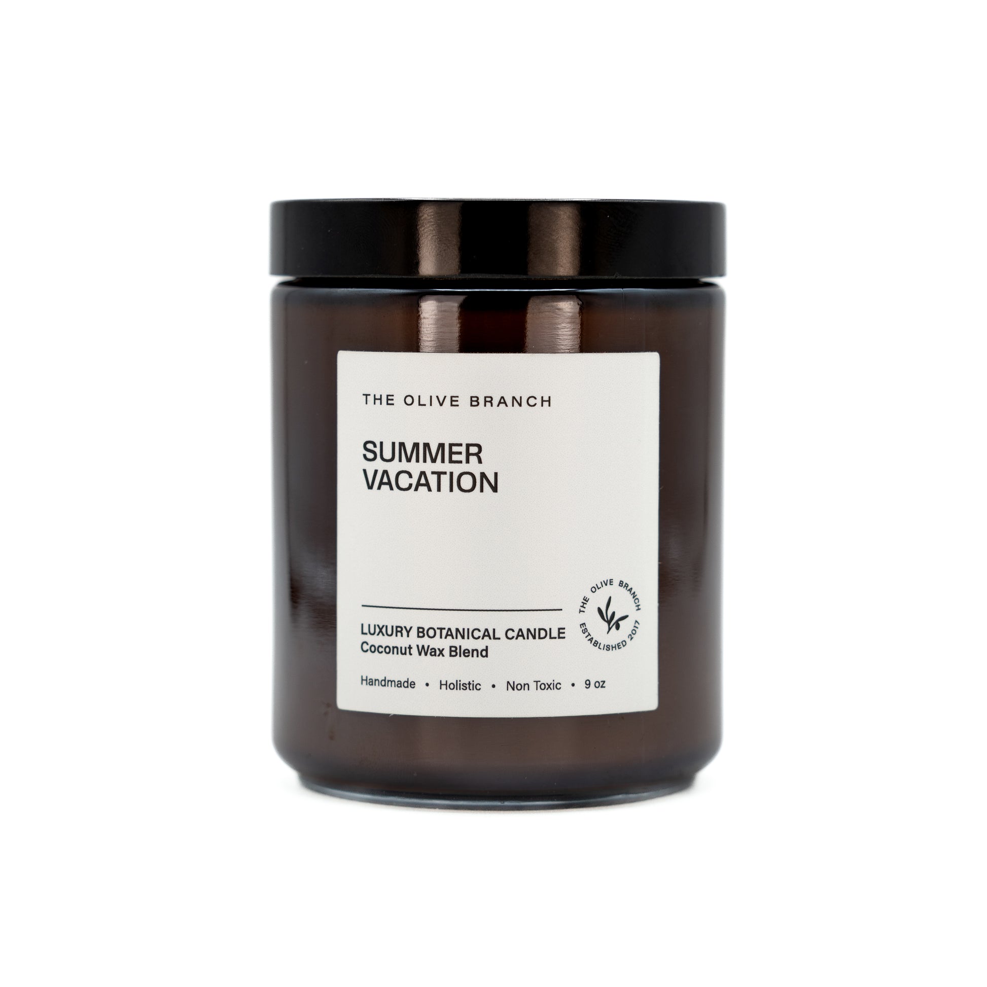 Candle jar labeled 'Summer Vacation' by The Olive Branch on a white background