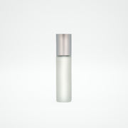 Silver cylindrical bottle on a light gray background