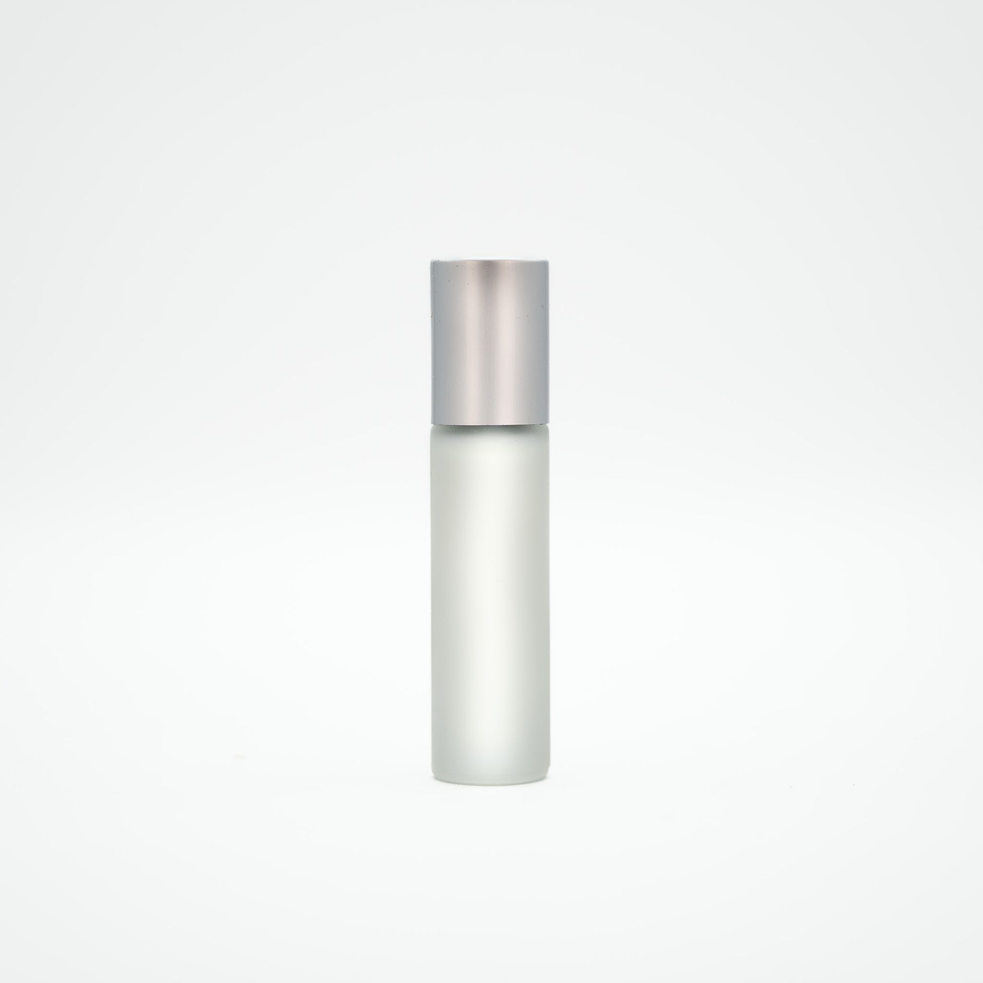 Silver cylindrical bottle on a light gray background