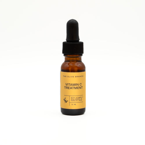 Vitamin C treatment bottle with dropper on a white background
