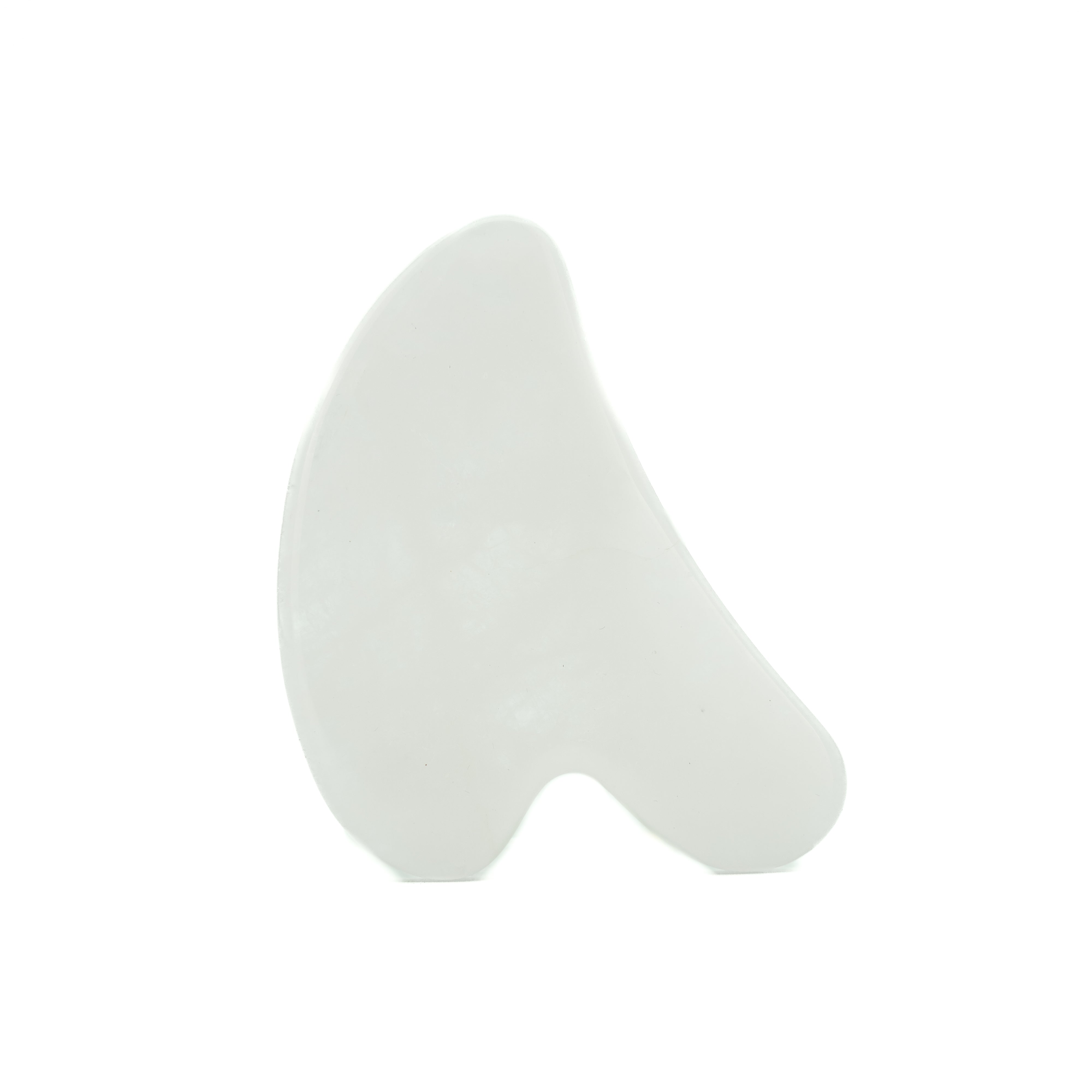White jade gua sha on a white background.